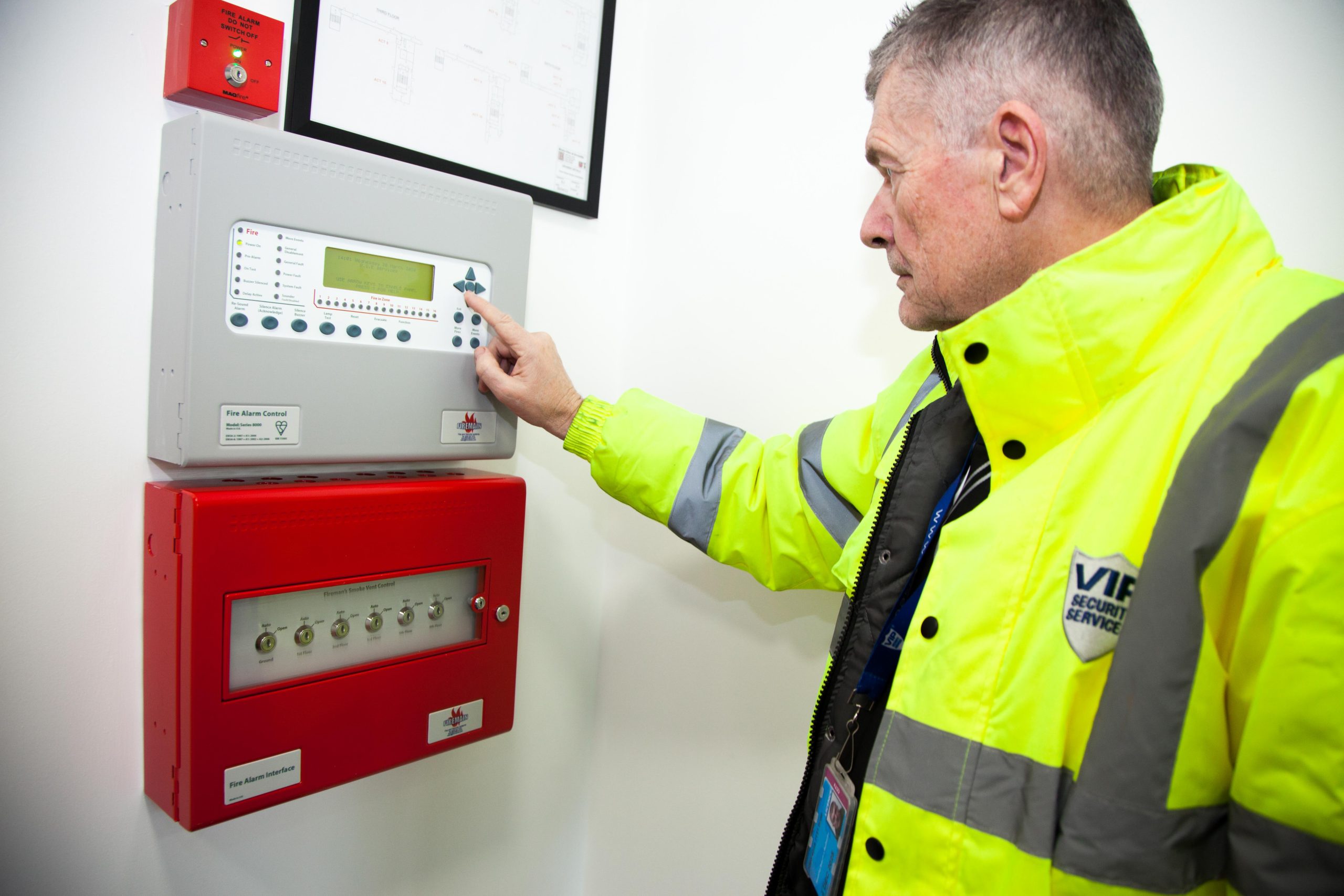 VIP Security System's guard controlling an intruder alarm 