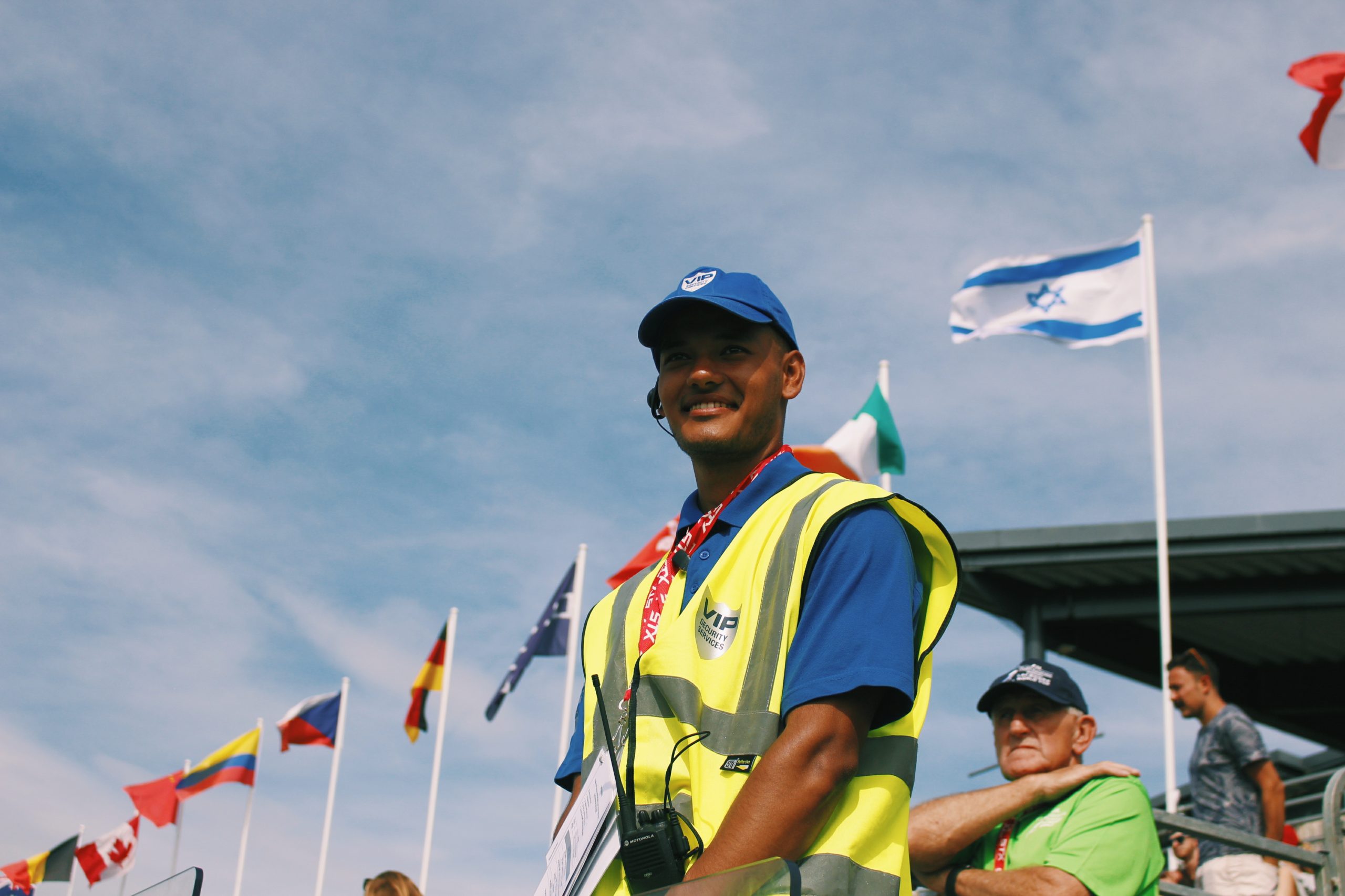 VIP Security with flags in the background